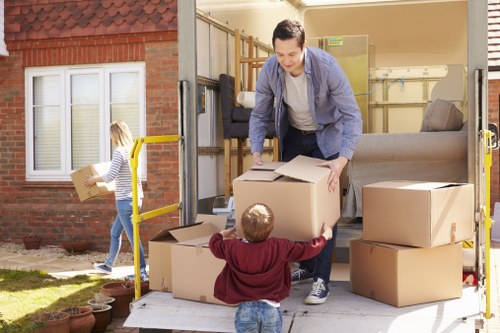 Packed moving boxes and furniture ready for transport in Battersea