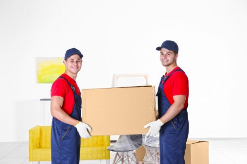 Moving team handling items safely with protective equipment