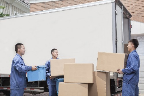 Man and van team loading furniture for a Battersea move