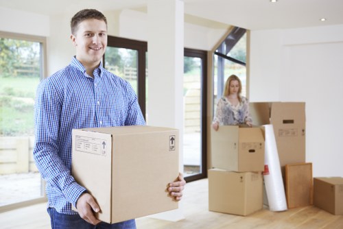 Moving team handling furniture near Battersea streets