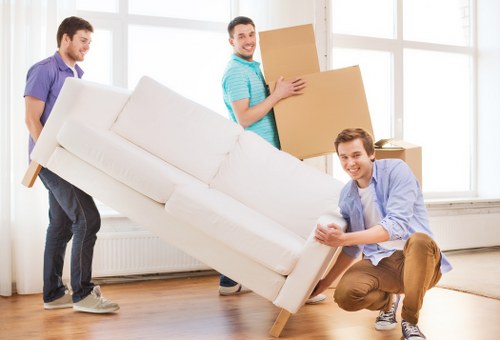 Boxes and furniture prepared for loading on moving day in Battersea