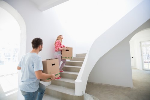 Professional movers handling fragile items during a Battersea home removal