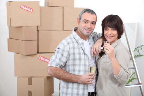 Packed office boxes and furniture ready for relocation in Battersea