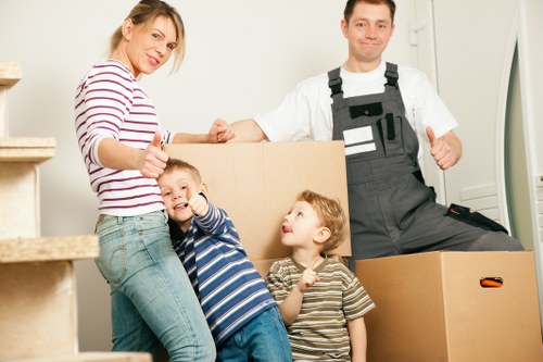 Careful unloading of household items at a Battersea property